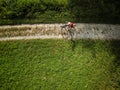 Pretty, young woman riding her mountain bike on a forest path Royalty Free Stock Photo