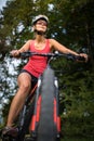 Pretty, young woman riding her mountain bike Royalty Free Stock Photo