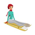 Pretty young woman riding a snow sled on isolated background