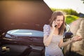 Pretty, young woman by the roadside Royalty Free Stock Photo