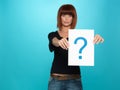 Pretty young woman showing a question mark Royalty Free Stock Photo