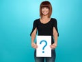 Pretty young woman showing a question mark Royalty Free Stock Photo