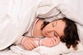 Pretty young woman sleeping on white bed Royalty Free Stock Photo