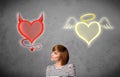 Woman standing between the angel and devil hearts Royalty Free Stock Photo