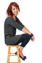 Pretty young woman on a stool