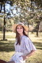 Pretty young woman in a summer garden, casual romantic style with hat Royalty Free Stock Photo