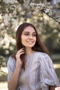 Pretty young woman in a summer garden, casual romantic style with hat Royalty Free Stock Photo