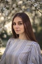 Pretty young woman in a summer garden, casual romantic style with hat Royalty Free Stock Photo