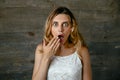 Beautiful surprised woman with widely open mouth Royalty Free Stock Photo