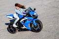 Pretty young woman and Suzuki GSX-R750