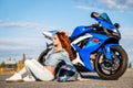 Pretty young woman and Suzuki GSX-R750