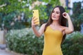 Pretty young woman, taking a selfie with her smartphone Royalty Free Stock Photo