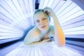 Pretty, young woman tanning her skin Royalty Free Stock Photo