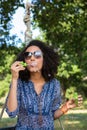 Pretty young woman in tire swing Royalty Free Stock Photo