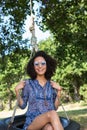 Pretty young woman in tire swing Royalty Free Stock Photo