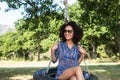 Pretty young woman in tire swing Royalty Free Stock Photo