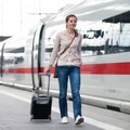 Pretty woman at a train station Royalty Free Stock Photo