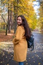 Pretty Young Woman Walking in Autumn Park Leaves Fall Relax Leisure Fashion Modern Golden Yellow Royalty Free Stock Photo