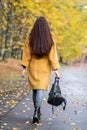 Pretty Young Woman Walking in Autumn Park Leaves Fall Relax Leisure Fashion Modern Golden Yellow Royalty Free Stock Photo