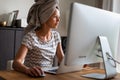 Pretty, young woman working at her computer from home Royalty Free Stock Photo