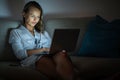 Pretty, young woman working on her laptop computer Royalty Free Stock Photo