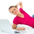 Pretty, young woman working on her laptop computer Royalty Free Stock Photo