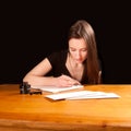 Pretty young woman writing a letter Royalty Free Stock Photo