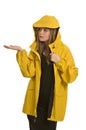 A pretty young woman in a yellow raincoat