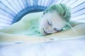 Pretty young womanin a modern solarium Royalty Free Stock Photo