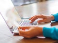 Pretty Young womans hands holding a credit card Royalty Free Stock Photo