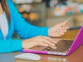 Pretty Young womans hands holding a credit card Royalty Free Stock Photo