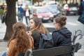 3 girls sitting on a bench