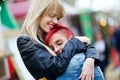 Pretty young women giving a hug on the street.