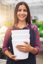 Pretty young worker in a floriculture business Royalty Free Stock Photo
