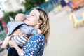 Prettyl happy mather with baby boy Embracing him emotionally on a liking Royalty Free Stock Photo