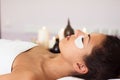 Prettyl woman with facial mask at beauty salon. Spa treatment Royalty Free Stock Photo