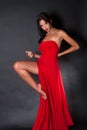 Prety woman wearing red fabric like a dress Royalty Free Stock Photo