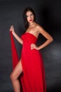 Prety woman wearing red fabric like a dress Royalty Free Stock Photo