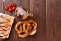 Pretzel, beer mug and grilled shrimps Royalty Free Stock Photo