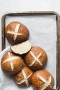 Pretzel buns on a parchment lined baking sheet Royalty Free Stock Photo