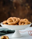 Pretzel cookies with sugar on a Christmas background. Sugar cookies. Royalty Free Stock Photo