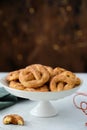 Pretzel cookies with sugar on a Christmas background. Sugar cookies. Royalty Free Stock Photo