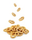 Pretzel with many small cookies scattered on a white background. Traditional food for Oktoberfest - salt appetizer pretzels on a