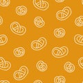 Pretzel seamless pattern. Bakery doodle product German salted lye biscuit, cartoon white elements on yellow, decor textile, fabric Royalty Free Stock Photo