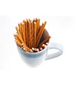 Pretzel sticks in a white cup isolated Royalty Free Stock Photo