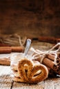 Pretzels with ground cinnamon, cinnamon sticks, brown cane sugar Royalty Free Stock Photo