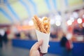 pretzels in a paper cone at a fair