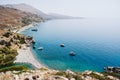 Preveli beach at Libyan sea, bay with ships and mountains , Crete , Greece