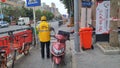 Shenzhen, China: prevent and combat the new coronavirus pneumonia on the streets, delivery couriers and some citizens