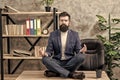 Prevent professional burnout. Man bearded manager formal suit sit lotus pose relaxing. Way to relax. Meditation yoga